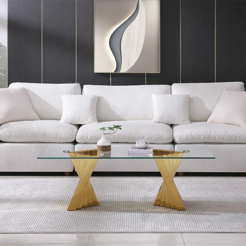 Table basse avec plateau en verre trempé et piètement en acier inoxydable finition miroir doré