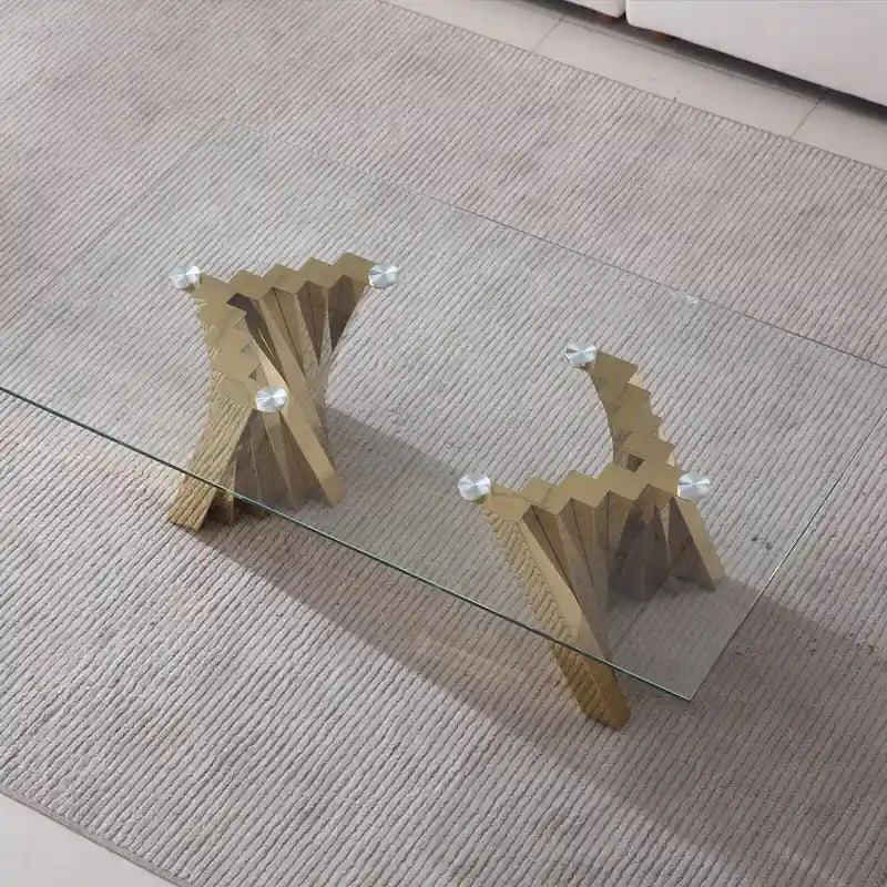 Table basse avec plateau en verre trempé et piètement en acier inoxydable finition miroir doré