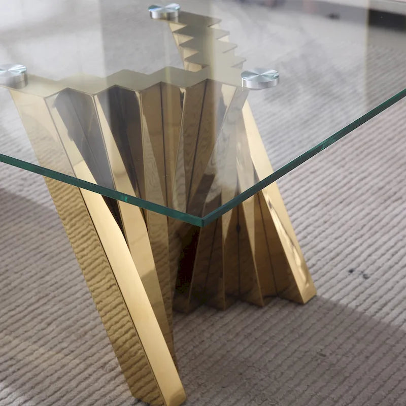 Table basse avec plateau en verre trempé et piètement en acier inoxydable finition miroir doré